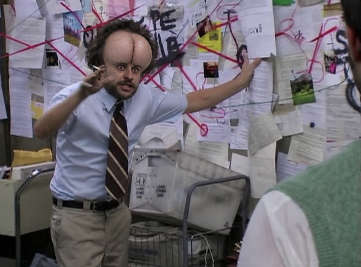 A man in an office with a digitally altered split forehead.