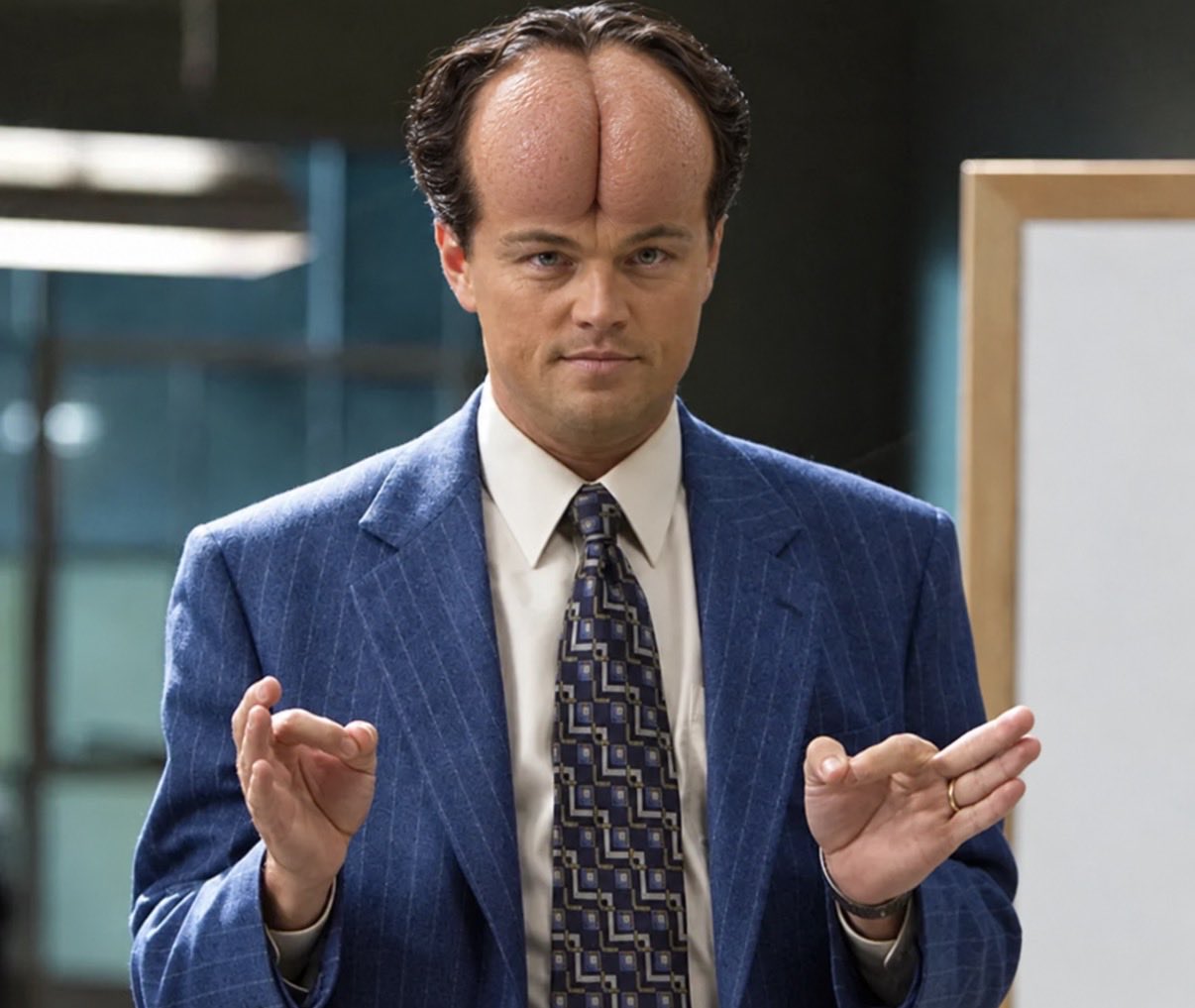 An office character with a digitally altered split forehead.